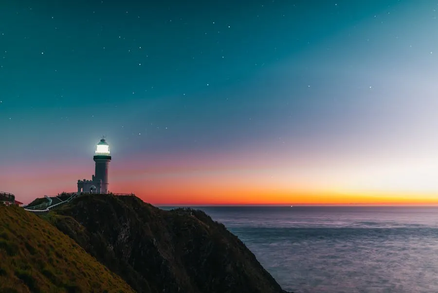 Byron Bay lighthouse overlooking the ocean at sunrise