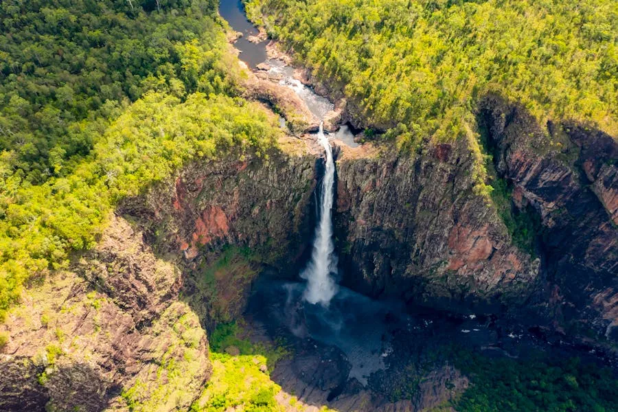 Waterfall cascading through monsoon forest in Kakadu National Park