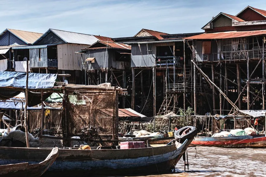 Wooden stilt houses lining the waterway at Kampong Phluk on Tonle Sap