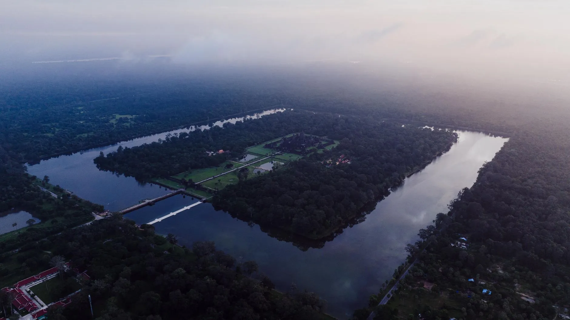 Aerial view of the Cambodian landscape with temples and lush terrain