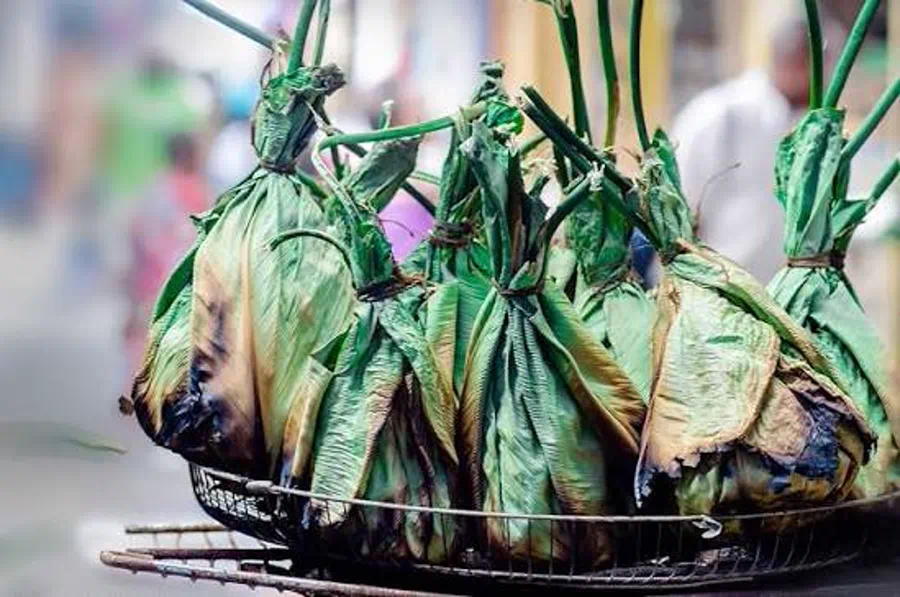 Fish wrapped in banana leaves for liboke