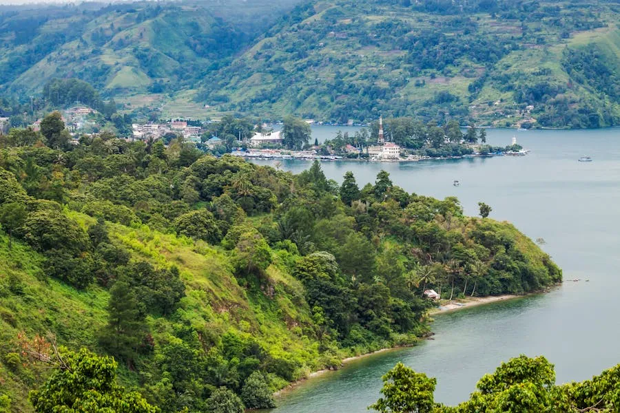 Scenic view of green hills sloping down to Lake Toba in Sumatra