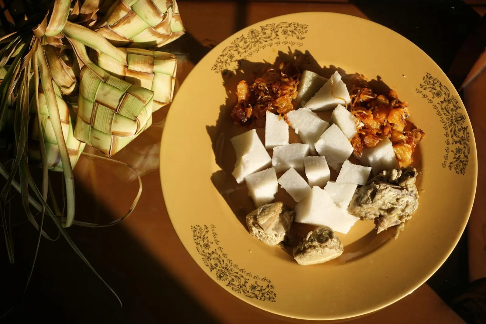 Appetizing Indonesian ketupat with rendang, a tasty and traditional meal from Bandung.