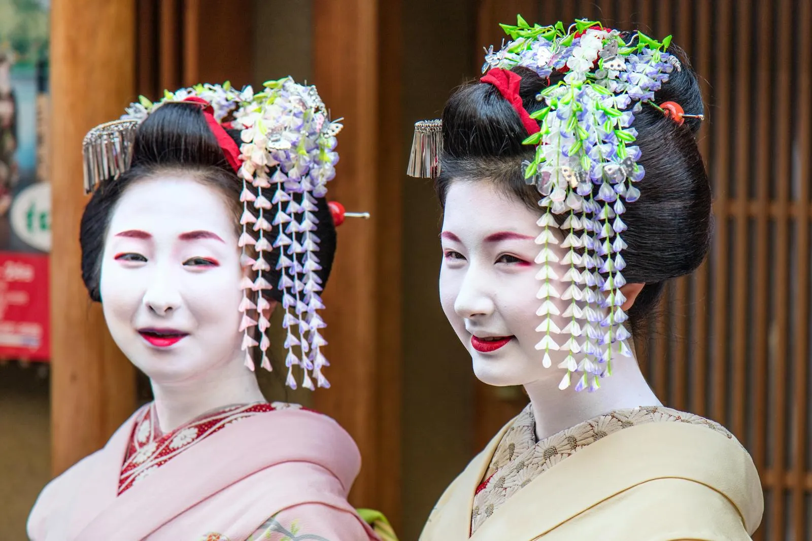 Elegant portrait of two geisha in traditional attire in Kyoto, Japan.