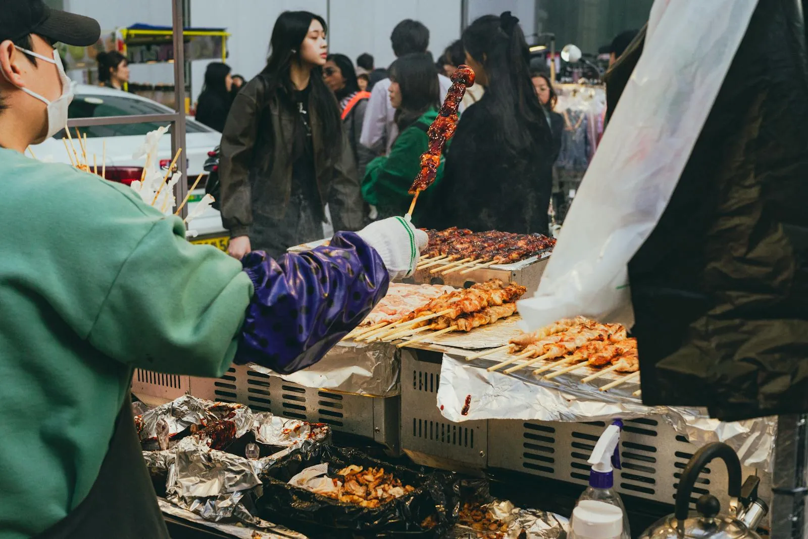 Discover the vibrant street food culture in Seoul with this lively market image.