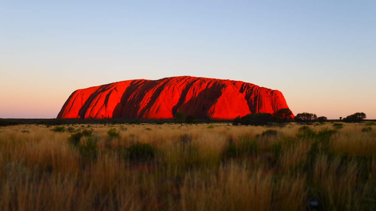 Uluru at sunset in the red desert