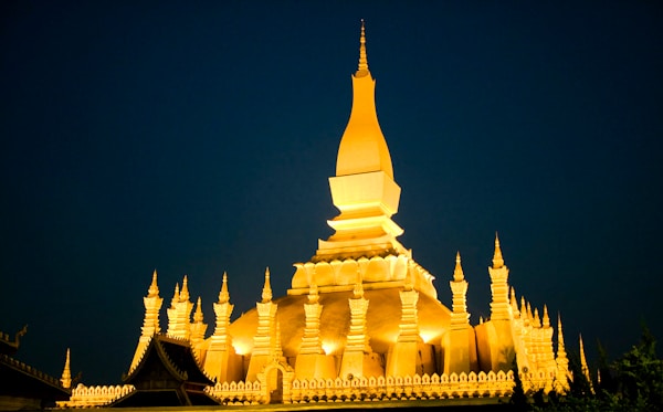 Historic white temple with golden details in Vientiane
