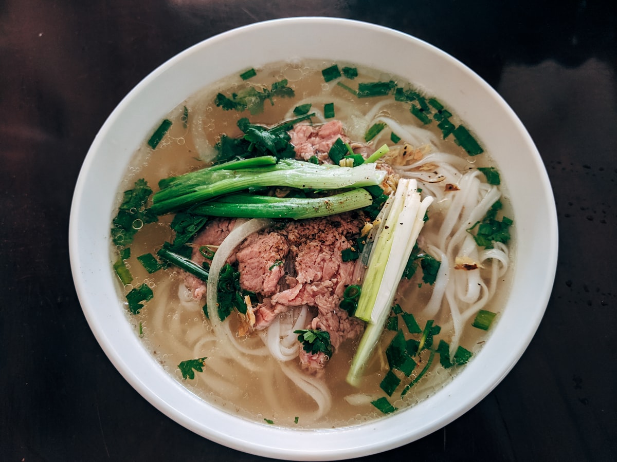 Vietnamese pho soup with fresh herbs